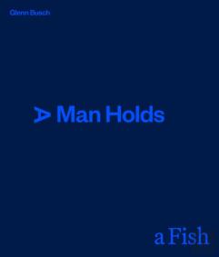 A Man Holds A Fish