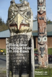 Black Bear Holds A Hole In His Paws