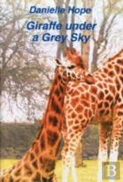 Giraffe Under A Grey Sky