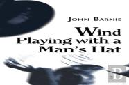 Wind Playing With A Man'S Hat